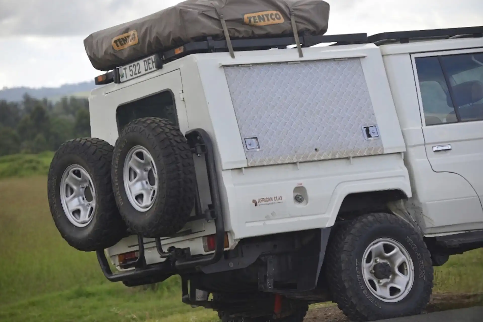 Land Cruiser safari vehicle with rooftop camper for Serengeti safari Tanzania
